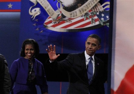 President Barack Obama waves as he and his wife Michelle depart the stage after the end of the first presidential debate against Republican President Barack Obama waves as he and his wife Michelle depart the stage after the end of the first presidential debate against Republican