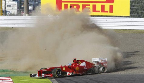 Ferrari Formula One driver Fernando Alonso of Spain loses control of his car in the first corner of the Japanese F1 Grand Prix at the Suzuka Ferrari Formula One driver Fernando Alonso of Spain loses control of his car in the first corner of the Japanese F1 Grand Prix at the Suzuka