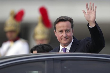 Britain's Prime Minister David Cameron waves as he leaves after a meeting with Brazil's President Dilma Rousseff at the Planalto Palace in B Britain's Prime Minister David Cameron waves as he leaves after a meeting with Brazil's President Dilma Rousseff at the Planalto Palace in B