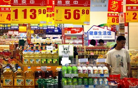 A customer looks at products on sale at a supermarket in central Beijing June 12, 2012. REUTERS/David Gray A customer looks at products on sale at a supermarket in central Beijing June 12, 2012. REUTERS/David Gray