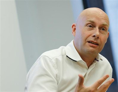 CEO of Dow Jones, Lex Fenwick speaks during an interview in his New York offices July 20, 2012. REUTERS/Brendan McDermid CEO of Dow Jones, Lex Fenwick speaks during an interview in his New York offices July 20, 2012. REUTERS/Brendan McDermid