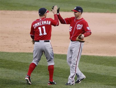 Washington Nationals' Ryan Zimmerman (L) and Adam LaRoche (R) celebrate after beating the St. Louis Cardinals in Game 1 of their MLB NLDS pl Washington Nationals' Ryan Zimmerman (L) and Adam LaRoche (R) celebrate after beating the St. Louis Cardinals in Game 1 of their MLB NLDS pl