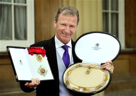 Britain's Cabinet Office head Gus O'Donnell poses for a photograph after he was made a Knight Grand Cross of the Order of the Bath by Queen Britain's Cabinet Office head Gus O'Donnell poses for a photograph after he was made a Knight Grand Cross of the Order of the Bath by Queen