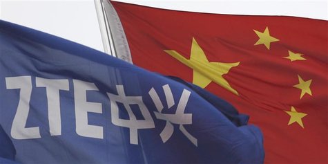 A ZTE flag flutters in front of the Chinese national flag outside its headquarters in Shenzhen, Guangdong province April 17, 2012. REUTERS/T A ZTE flag flutters in front of the Chinese national flag outside its headquarters in Shenzhen, Guangdong province April 17, 2012. REUTERS/T