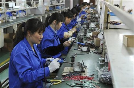 Employees make circuit boards at an electronic component factory in Hefei, Anhui province May 2, 2012. REUTERS/Stringer Employees make circuit boards at an electronic component factory in Hefei, Anhui province May 2, 2012. REUTERS/Stringer