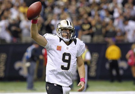 New Orleans Saints quarterback Drew Brees (9) celebrates after scoring a touchdown pass to break Johnny Unitas' record of consecutive games New Orleans Saints quarterback Drew Brees (9) celebrates after scoring a touchdown pass to break Johnny Unitas' record of consecutive games