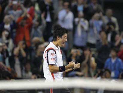 Kei Nishikori of Japan reacts after his win over Milos Raonic of Canada in the men's singles finals match at the Japan Open tennis champions Kei Nishikori of Japan reacts after his win over Milos Raonic of Canada in the men's singles finals match at the Japan Open tennis champions