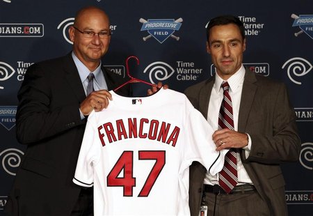 Cleveland Indians general manager Chris Antonetti (R) and Terry Francona (L) hold up a Francona jersey as the latter is introduced as the ne Cleveland Indians general manager Chris Antonetti (R) and Terry Francona (L) hold up a Francona jersey as the latter is introduced as the ne