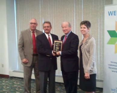 Doug Hekman (second from left) receives the 2012 Michigan West Coast Chamber of Commerce Small Business Person of the Year award from committee chair Skip Keener as Chamber Development Director Jim Schoettle (L) and President Jane Clark (R) look on at the Haworth Inn on Oct. 9, 2012. Doug Hekman (second from left) receives the 2012 Michigan West Coast Chamber of Commerce Small Business Person of the Year award from committee chair Skip Keener as Chamber Development Director Jim Schoettle (L) and President Jane Clark (R) look on at the Haworth Inn on Oct. 9, 2012.