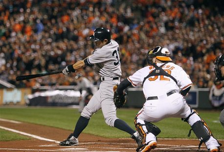 New York Yankees' Ichiro Suzuki hits an RBI double scoring Derek Jeter against the Baltimore Orioles in the first inning of Game 1 in their New York Yankees' Ichiro Suzuki hits an RBI double scoring Derek Jeter against the Baltimore Orioles in the first inning of Game 1 in their