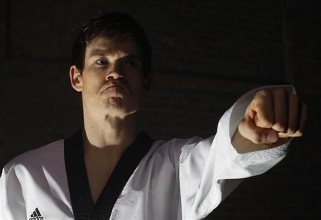 British Tae Kwon Do champion Aaron Cook poses for photos during a break in filming a promotional film at a location in central London, March British Tae Kwon Do champion Aaron Cook poses for photos during a break in filming a promotional film at a location in central London, March