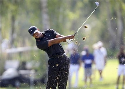 Tiger Woods of U.S. tees off on the 7th hole during his PGA World Golf Final Group 1 match against Charl Schwartzel of South Africa in Antal Tiger Woods of U.S. tees off on the 7th hole during his PGA World Golf Final Group 1 match against Charl Schwartzel of South Africa in Antal