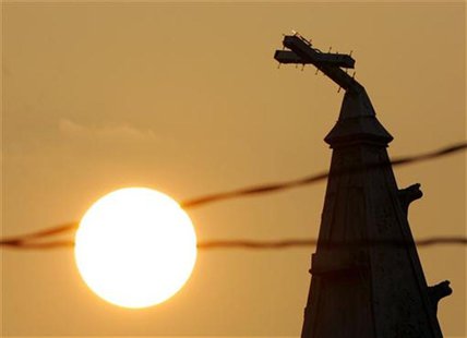 A broken cross is seen on the top of a church in New Orleans September 18, 2005. REUTERS/Carlos Barria A broken cross is seen on the top of a church in New Orleans September 18, 2005. REUTERS/Carlos Barria