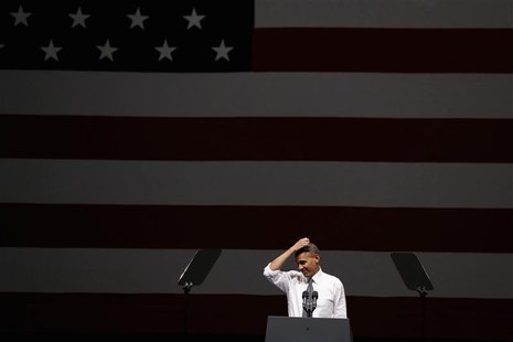 U.S. President Barack Obama gestures while speaking at an Obama Victory Fund concert while at the Bill Graham Civic Auditorium in San Franci U.S. President Barack Obama gestures while speaking at an Obama Victory Fund concert while at the Bill Graham Civic Auditorium in San Franci