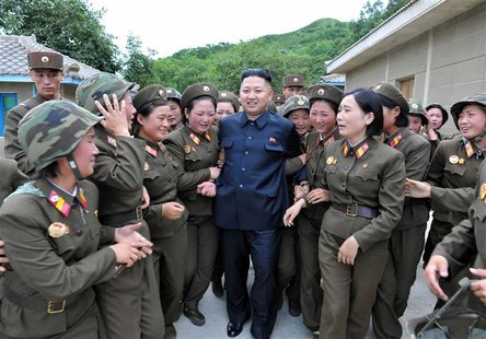 North Korean leader Kim Jong-un (C) visits the Thrice Three-Revolution Red Flag Kamnamu (persimmon tree) Company under the Korean People's A North Korean leader Kim Jong-un (C) visits the Thrice Three-Revolution Red Flag Kamnamu (persimmon tree) Company under the Korean People's A