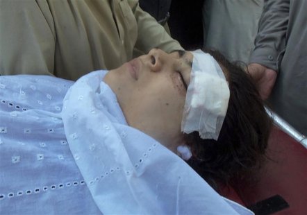 Hospital staff assists Malala Yousufzai, a 14-year-old schoolgirl who was wounded in a gun attack, at the Saidu Sharif Teaching Hospital in Hospital staff assists Malala Yousufzai, a 14-year-old schoolgirl who was wounded in a gun attack, at the Saidu Sharif Teaching Hospital in