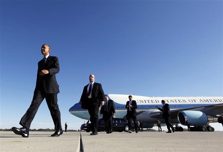 U.S. President Barack Obama walks towards supporters after arriving at Rickenbacker Inland Port in Columbus, Ohio October 9, 2012, ending a U.S. President Barack Obama walks towards supporters after arriving at Rickenbacker Inland Port in Columbus, Ohio October 9, 2012, ending a