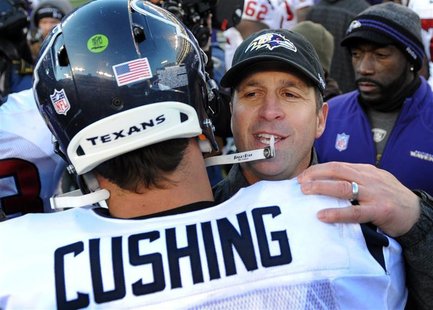 Baltimore Ravens head coach John Harbaugh (C) hugs Houston Texans inside linebacker Brian Cushing (L) following their NFL AFC Divisional Pla Baltimore Ravens head coach John Harbaugh (C) hugs Houston Texans inside linebacker Brian Cushing (L) following their NFL AFC Divisional Pla