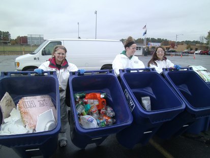 Mosinee High School Green Team members Emily Babcock (left) Hannah Hill (center) and Kortney Marshall (right) showing some of the recyclable materials removed from the garbage. Mosinee High School Green Team members Emily Babcock (left) Hannah Hill (center) and Kortney Marshall (right) showing some of the recyclable materials removed from the garbage.