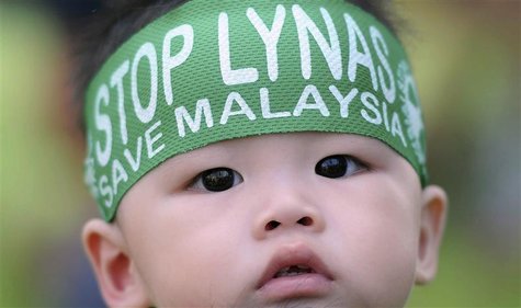 A child wears a headband during a protest against the construction of Australia's Lynas Corp earths plant in Gebeng, 270 km (168 miles) east A child wears a headband during a protest against the construction of Australia's Lynas Corp earths plant in Gebeng, 270 km (168 miles) east