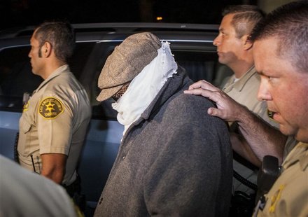 Nakoula Basseley Nakoula (C) is escorted out of his home by Los Angeles County Sheriff's officers in Cerritos, California September 15, 2012 Nakoula Basseley Nakoula (C) is escorted out of his home by Los Angeles County Sheriff's officers in Cerritos, California September 15, 2012