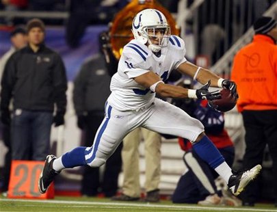 Indianapolis Colts running back Donald Brown catches a pass against the New England Patriots in the second quarter of their NFL football gam Indianapolis Colts running back Donald Brown catches a pass against the New England Patriots in the second quarter of their NFL football gam