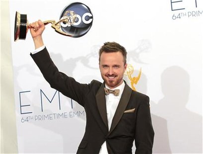 Aaron Paul raises the Emmy award for outstanding supporting actor for a drama series for his role in "Breaking Bad" at the 64th Primetime Em Aaron Paul raises the Emmy award for outstanding supporting actor for a drama series for his role in "Breaking Bad" at the 64th Primetime Em