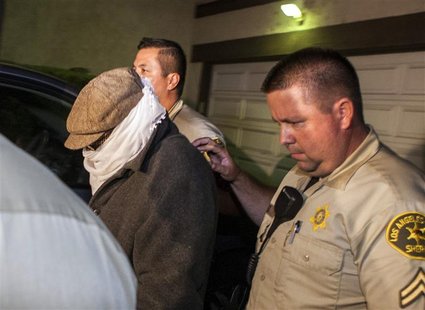 Nakoula Basseley Nakoula (L) is escorted out of his home by Los Angeles County Sheriff's officers in Cerritos, California September 15, 2012 Nakoula Basseley Nakoula (L) is escorted out of his home by Los Angeles County Sheriff's officers in Cerritos, California September 15, 2012