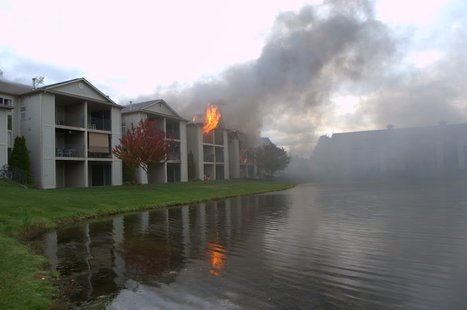Flames shooting from apartment unit. Photo Credit: Joel Oswald Flames shooting from apartment unit. Photo Credit: Joel Oswald