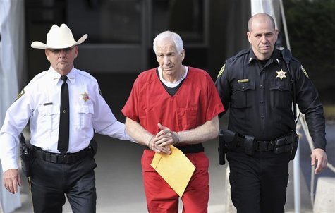 Jerry Sandusky (C) leaves the Centre County Courthouse after his sentencing in his child sex abuse case in Bellefonte, Pennsylvania October Jerry Sandusky (C) leaves the Centre County Courthouse after his sentencing in his child sex abuse case in Bellefonte, Pennsylvania October