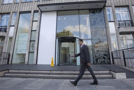 A man walks past the office building that houses Bumi Plc in London September 25, 2012. Picture taken September 25, 2012. REUTERS/Neil Hall A man walks past the office building that houses Bumi Plc in London September 25, 2012. Picture taken September 25, 2012. REUTERS/Neil Hall