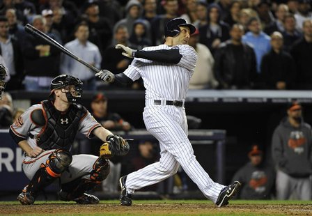 New York Yankees' Raul Ibanez hits a solo home run in front of Baltimore Orioles catcher Matt Wieters during the ninth inning in Game 3 of t New York Yankees' Raul Ibanez hits a solo home run in front of Baltimore Orioles catcher Matt Wieters during the ninth inning in Game 3 of t