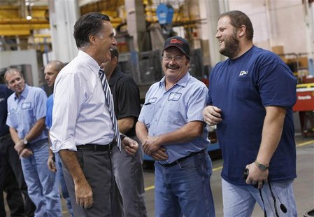 Republican presidential nominee Mitt Romney smiles while meeting members of the assembly line at Ariel Corporation before a town hall campai Republican presidential nominee Mitt Romney smiles while meeting members of the assembly line at Ariel Corporation before a town hall campai