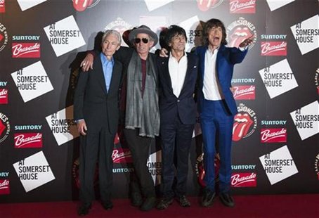 The Rolling Stones (L-R) Charlie Watts, Keith Richards, Ronnie Wood and Mick Jagger pose as they arrive for the opening of the exhibition "R The Rolling Stones (L-R) Charlie Watts, Keith Richards, Ronnie Wood and Mick Jagger pose as they arrive for the opening of the exhibition "R