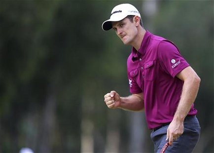 Justin Rose of England celebrates his victory against Tiger Woods of the U.S. after their World Golf Final semi-final match in Antalya, sout Justin Rose of England celebrates his victory against Tiger Woods of the U.S. after their World Golf Final semi-final match in Antalya, sout