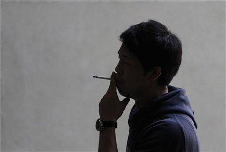 A man smokes a cigarette in Los Angeles, California, May 31, 2012. Californians will vote next week on Proposition 29, which would increase A man smokes a cigarette in Los Angeles, California, May 31, 2012. Californians will vote next week on Proposition 29, which would increase
