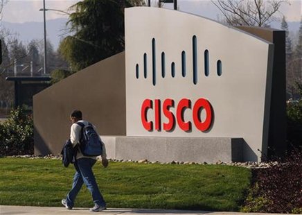 A pedestrian walks past the Cisco logo at the technology company's campus in San Jose, California February 3, 2010. REUTERS/Robert Galbraith A pedestrian walks past the Cisco logo at the technology company's campus in San Jose, California February 3, 2010. REUTERS/Robert Galbraith