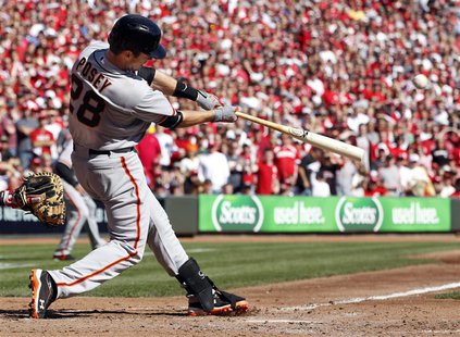 San Francisco Giants catcher Buster Posey hits a 5th inning grand slam home run against the Cincinnati Reds during Game 5 of their MLB NLDS San Francisco Giants catcher Buster Posey hits a 5th inning grand slam home run against the Cincinnati Reds during Game 5 of their MLB NLDS