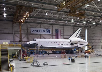 The space shuttle Endeavour is seen atop the Over Land Transporter (OLT) in a hangar at Los Angeles International Airport, in this September The space shuttle Endeavour is seen atop the Over Land Transporter (OLT) in a hangar at Los Angeles International Airport, in this September