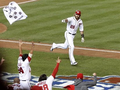 Washington Nationals' Jayson Werth points to the bench after hitting a game winning walk off solo home run during the ninth inning in Game 4 Washington Nationals' Jayson Werth points to the bench after hitting a game winning walk off solo home run during the ninth inning in Game 4