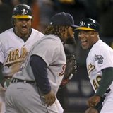 YOU'RE GOING DOWN, PRINCE! Oakland Athletics center fielder Coco Crisp (L) and first base coach Tye Waller celebrate Crisp's game winning RBI in the 9th inning as Detroit Tigers first baseman Prince Fielder (28) walks off the field during Game 4 of their MLB ALDS playoff baseball series in Oakland, California October 10, 2012. REUTERS/Robert Galbraith