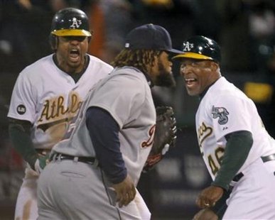 YOU'RE GOING DOWN, PRINCE! Oakland Athletics center fielder Coco Crisp (L) and first base coach Tye Waller celebrate Crisp's game winning RBI in the 9th inning as Detroit Tigers first baseman Prince Fielder (28) walks off the field during Game 4 of their MLB ALDS playoff baseball series in Oakland, California October 10, 2012. REUTERS/Robert Galbraith YOU'RE GOING DOWN, PRINCE! Oakland Athletics center fielder Coco Crisp (L) and first base coach Tye Waller celebrate Crisp's game winning RBI in the 9th inning as Detroit Tigers first baseman Prince Fielder (28) walks off the field during Game 4 of their MLB ALDS playoff baseball series in Oakland, California October 10, 2012. REUTERS/Robert Galbraith