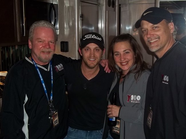 Y100 surrounds Justin Moore and steals his beer... Dan Stone told us it was okay... sorry HR.