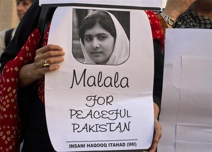An activist from non-governmental organisation Insani Haqooq Ittihad hold a picture of Malala Yousufzai during a demonstration in Islamabad An activist from non-governmental organisation Insani Haqooq Ittihad hold a picture of Malala Yousufzai during a demonstration in Islamabad