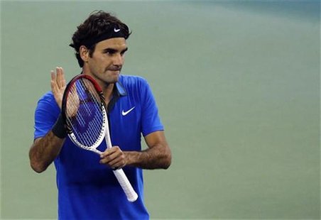Switzerland's Roger Federer reacts after winning his men's singles quarterfinals tennis match against Croatia's Marin Cilic at the Shanghai Switzerland's Roger Federer reacts after winning his men's singles quarterfinals tennis match against Croatia's Marin Cilic at the Shanghai