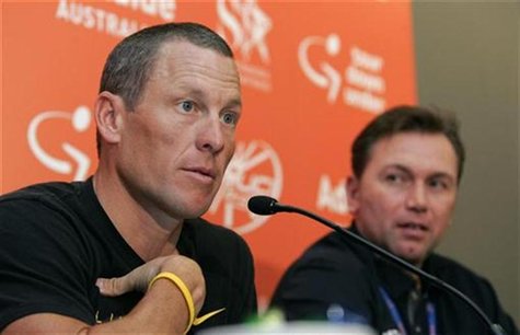 Seven-time Tour de France winner Lance Armstrong (L) talks to the media as Astana team general manager Johan Bruyneel looks on during news c Seven-time Tour de France winner Lance Armstrong (L) talks to the media as Astana team general manager Johan Bruyneel looks on during news c