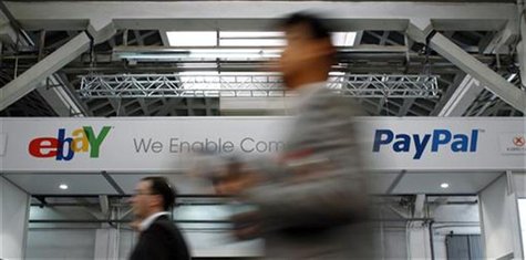 Visitors walk past an Ebay and PayPal banner at the Mobile World Congress in Barcelona February 28, 2012. REUTERS/Albert Gea Visitors walk past an Ebay and PayPal banner at the Mobile World Congress in Barcelona February 28, 2012. REUTERS/Albert Gea