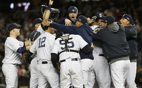 The New York Yankees celebrate after defeating the Baltimore Orioles in Game 5 of their MLB ALDS baseball playoff series in New York, Octobe The New York Yankees celebrate after defeating the Baltimore Orioles in Game 5 of their MLB ALDS baseball playoff series in New York, Octobe