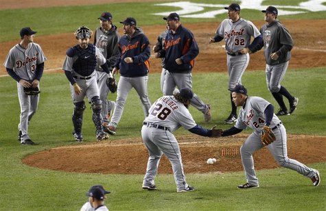 Detroit Tigers first baseman Prince Fielder (28) and third baseman Miguel Cabrera celebrate after the Tigers defeated the New York Yankees i Detroit Tigers first baseman Prince Fielder (28) and third baseman Miguel Cabrera celebrate after the Tigers defeated the New York Yankees i