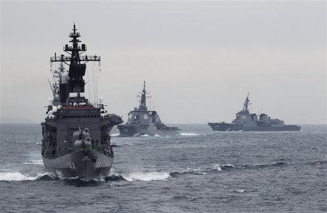 Japanese Maritime Self-Defense Force (MSDF) destroyer Kurama (L), which is carrying Japan's Prime Minister Yoshihiko Noda, leads the MSDF fl Japanese Maritime Self-Defense Force (MSDF) destroyer Kurama (L), which is carrying Japan's Prime Minister Yoshihiko Noda, leads the MSDF fl